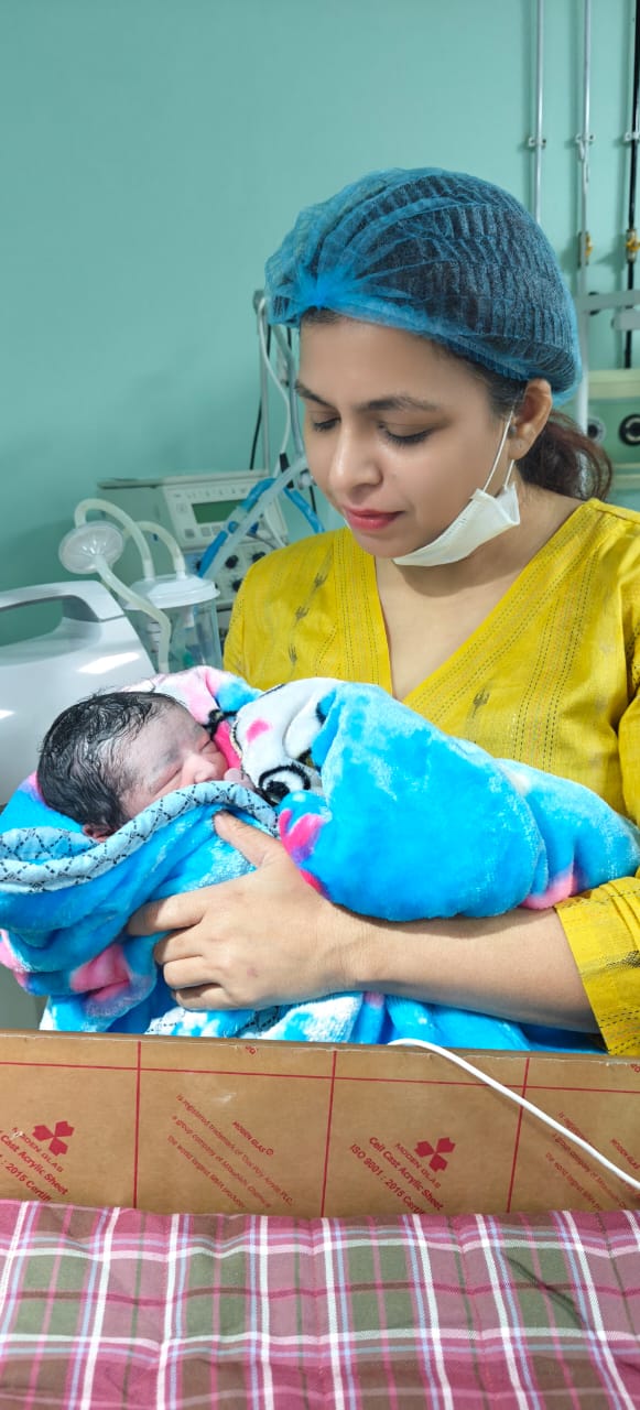 Maternity Doctor Holding Newborn Lifestyle